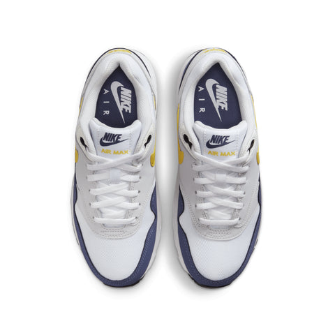 White Nike Air Max sneakers with blue and yellow accents on a white background