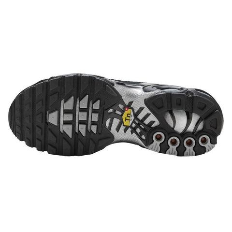 Close-up of a black and gray shoe sole with brand logo on a white background