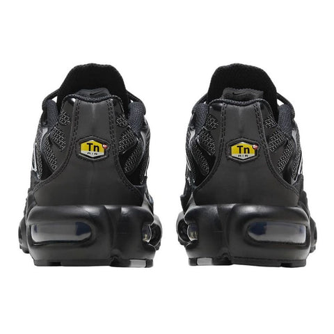 Black sneakers with a visible brand logo on a white background