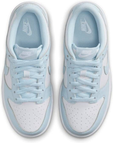 Pair of light blue and white Nike sneakers on a white background