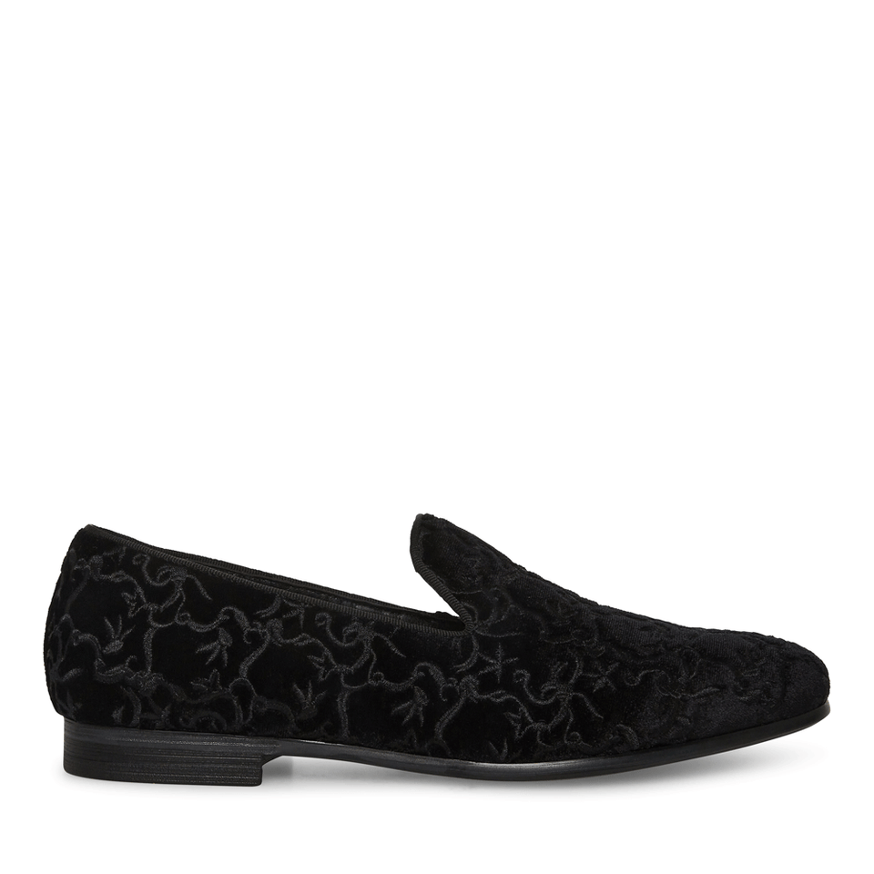 Black velvet loafer with floral pattern on a white background