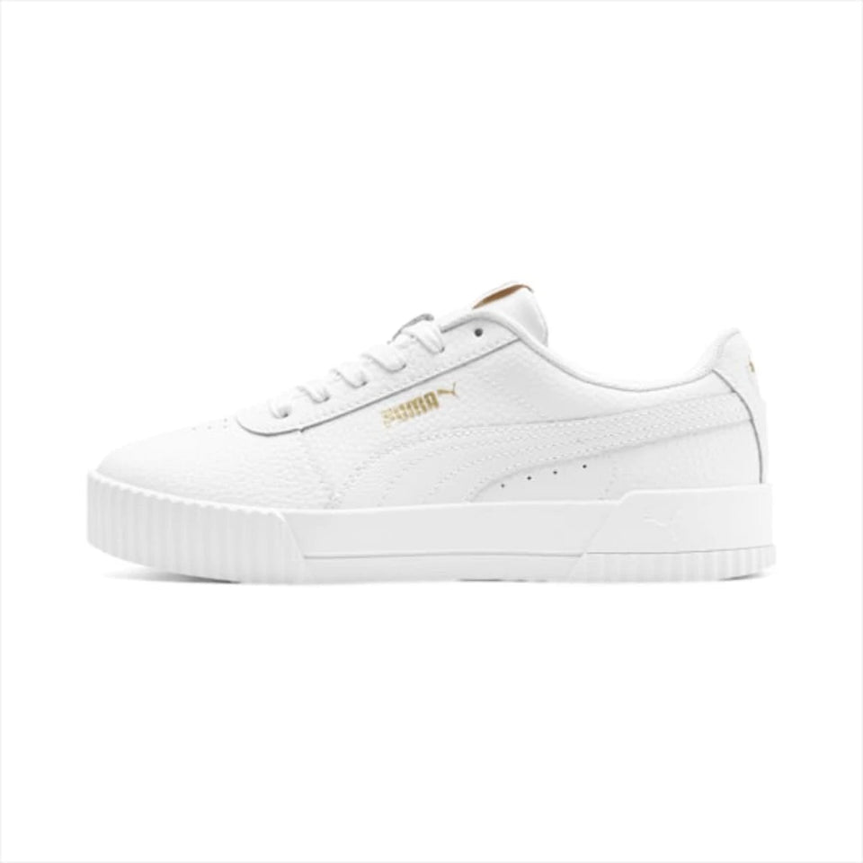 A white Puma Suede sneaker with gold branding details, shown from a side profile view against a solid white background.