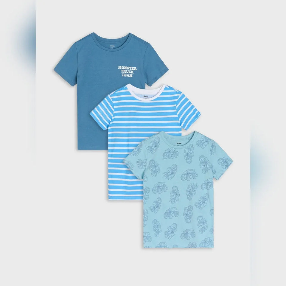 Three children's short-sleeve t-shirts in blue tones arranged in a stack on a light gray background. The top shirt is medium blue with white text reading 'MUMBAY SPORTS TEAM'.
