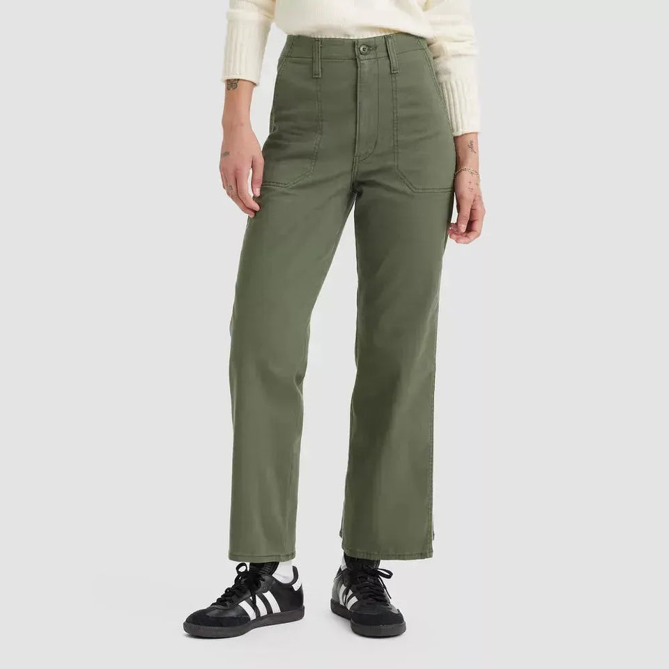 Person wearing olive green pants on a white background