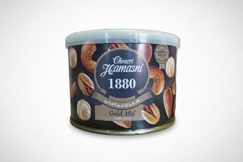 Tin of Choucri Hamasni 1880 Gold Mix on a table with boxes in the background