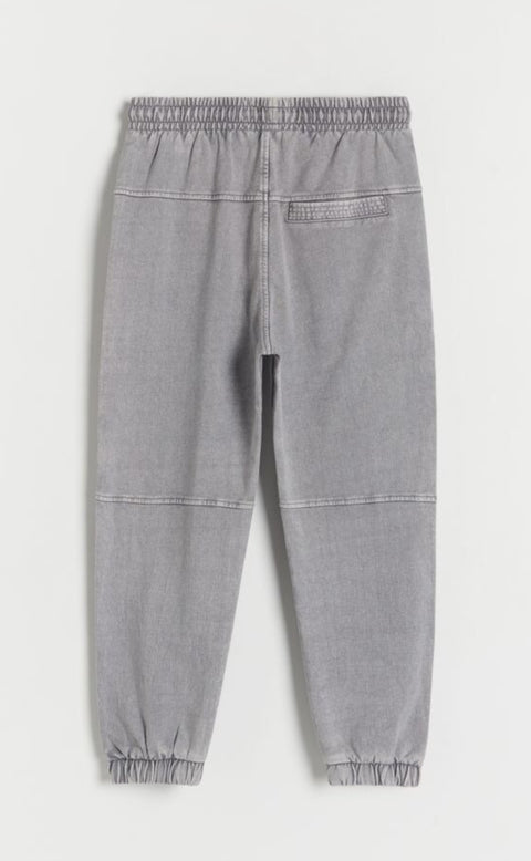 Gray jogger pants on a white background