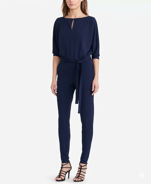 Navy blue jumpsuit worn by a model on a white background