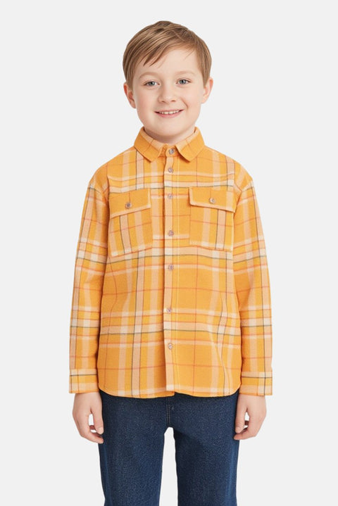 Child wearing a yellow plaid shirt on a white background