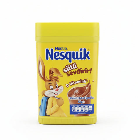 Nestle Nesquik powder container on a metal surface with a blurred background