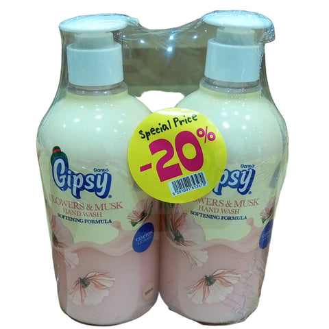 Two bottles of Gipsy product with a promotional label on a cardboard background