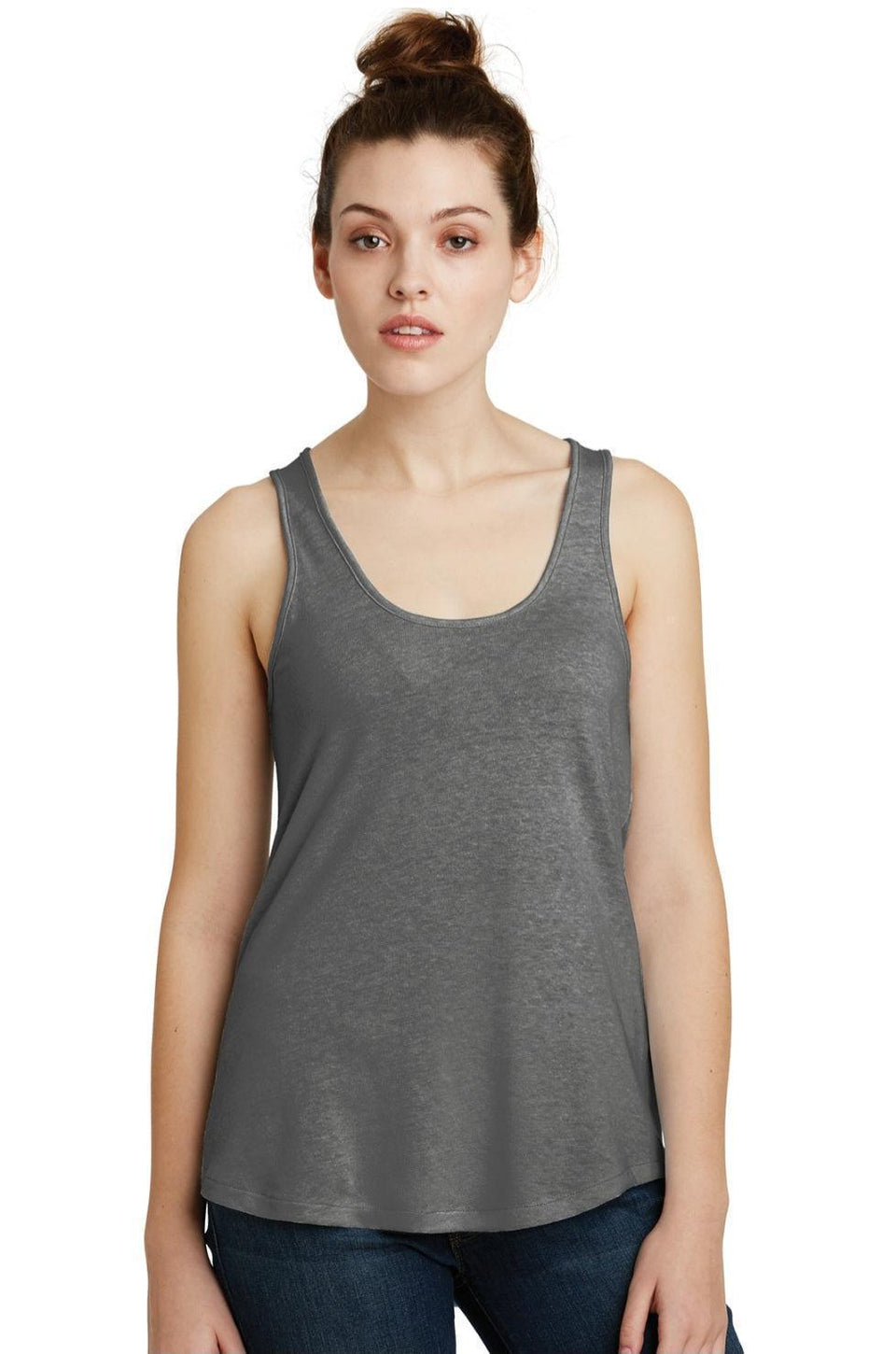 Woman wearing a gray tank top on a white background