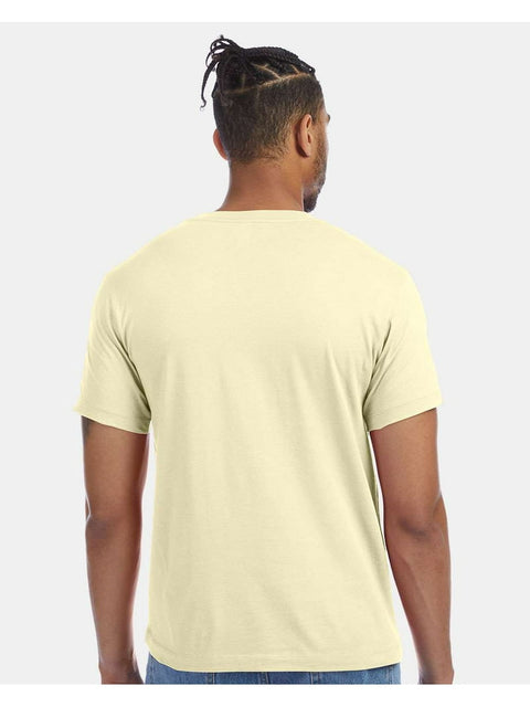 Person wearing a light yellow t-shirt on a white background
