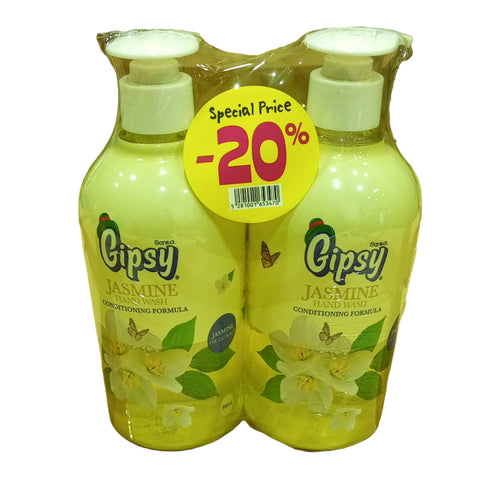 Two bottles of Gipsy lemon juice with a discount label on a wooden surface.