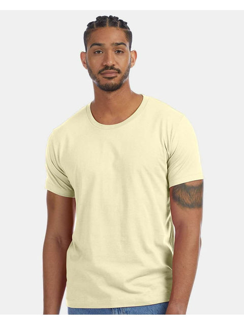 Man wearing a light yellow t-shirt on a white background