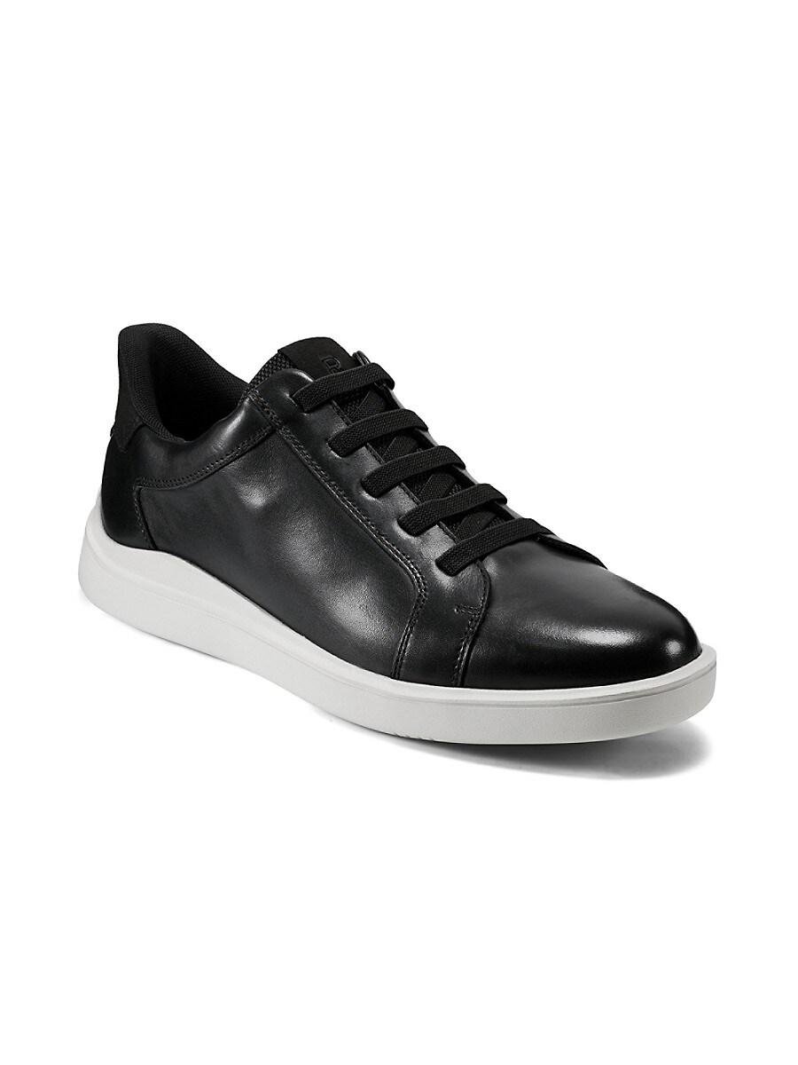 Black leather sneaker with white sole on a white background