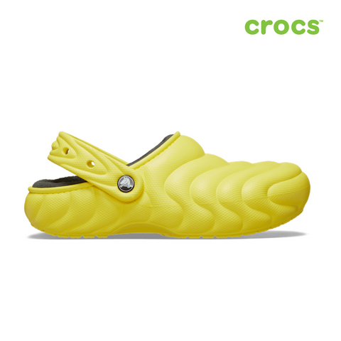 Yellow croc shoe with a white background and Crocs logo.