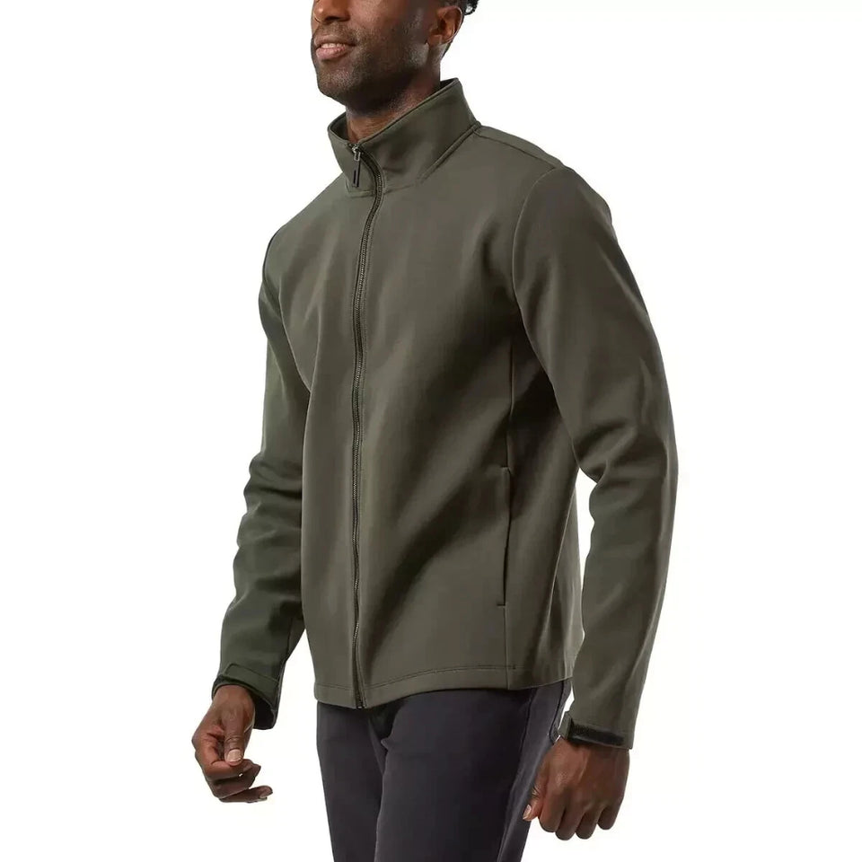 A man wearing an olive green full-zip fleece jacket and dark pants, shown from the waist up against a plain white background.