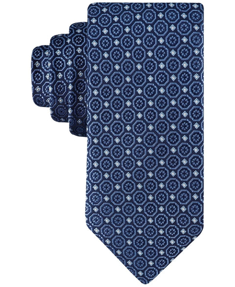Set of three blue patterned ties on a white background