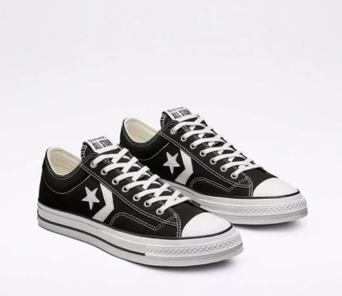 Black and white sneakers with a star logo on a white background