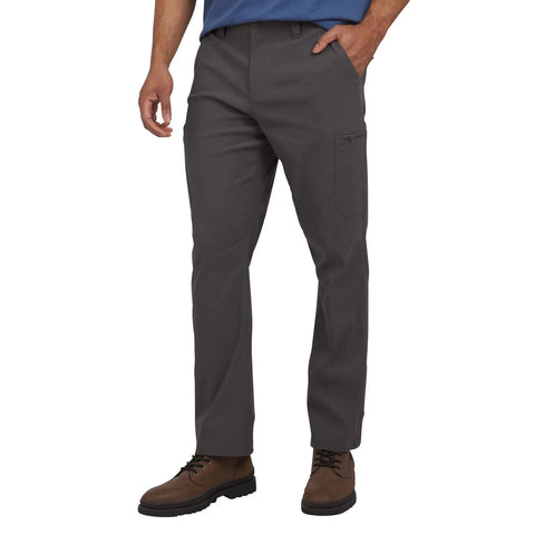 Person wearing gray pants with a white background