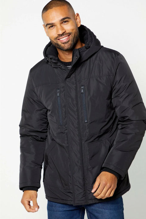 Man wearing a black jacket on a white background