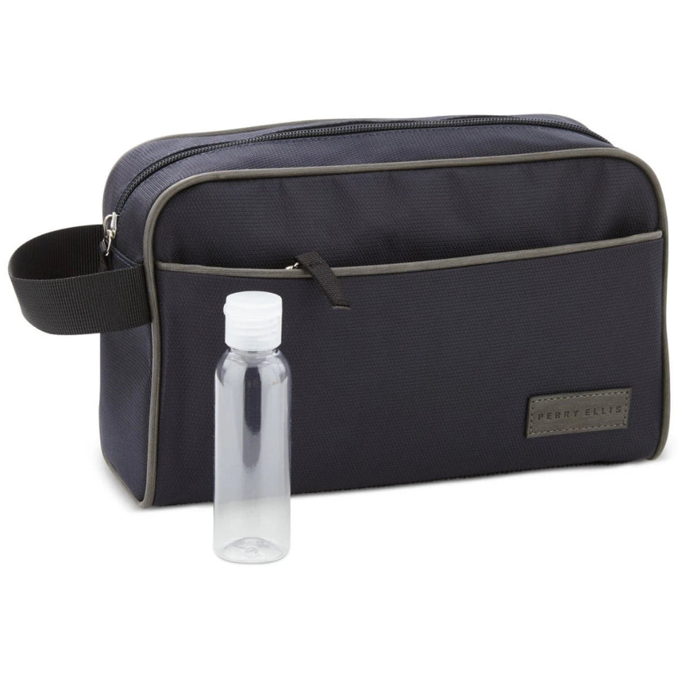 A dark navy blue toiletry bag with gray piping and a small clear plastic bottle, shown on a plain white background. The brand name 'SHEERY DELUXE' is visible on a small patch on the front of the bag.