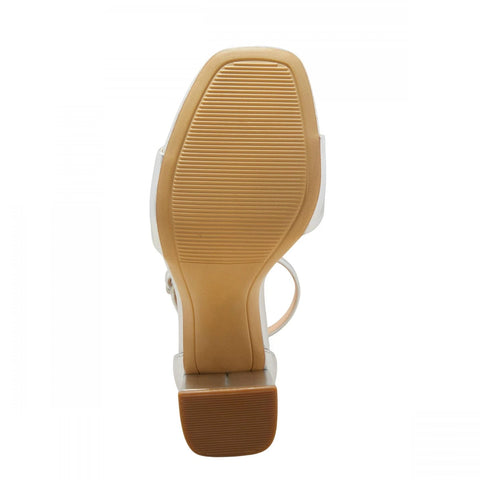 Close-up of a sandal sole with tan rubber on a white background