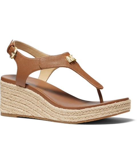 Brown wedge sandal with espadrille sole on a white background