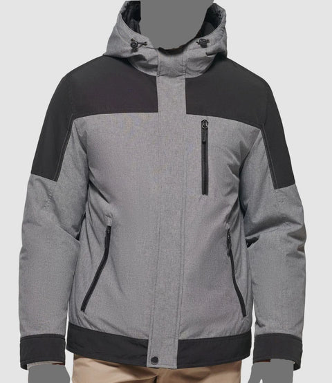 Gray and black jacket with a hood on a light gray background