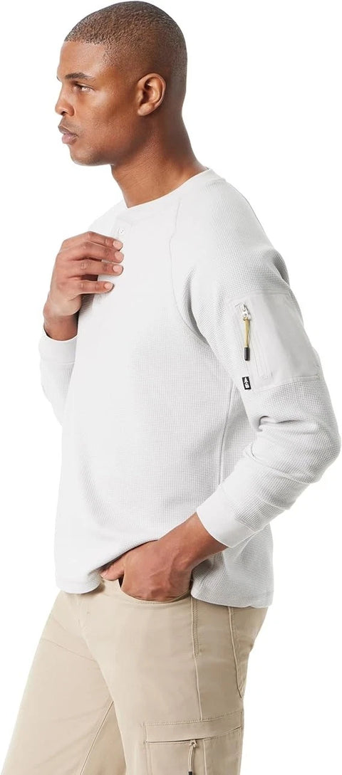 Man wearing a white long-sleeve shirt with a pocket detail on a white background