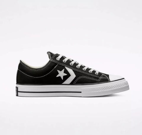 Black sneaker with white star logo on a white background