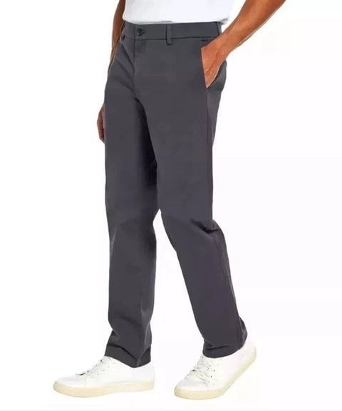Person wearing dark gray pants on a white background