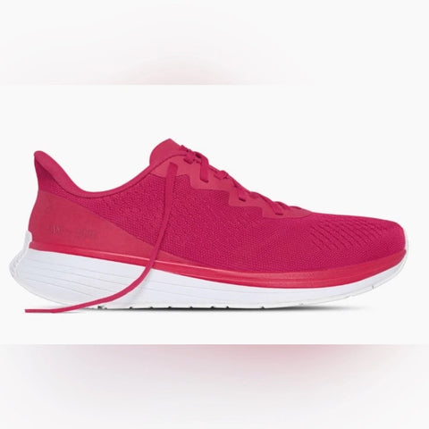 Pink running shoe with white sole on a light pink background