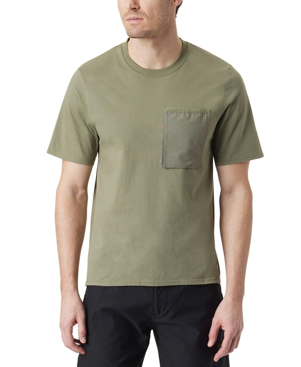 Man wearing an olive green t-shirt with a pocket on a white background