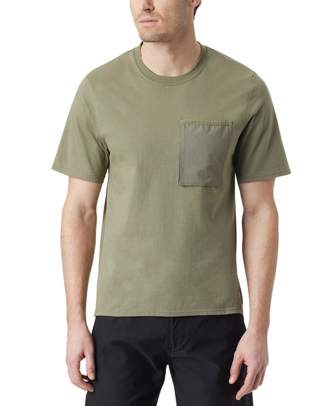 Man wearing an olive green t-shirt with a pocket on a white background