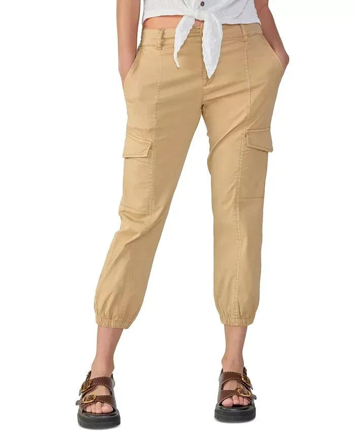 Beige cargo pants worn by a person on a white background