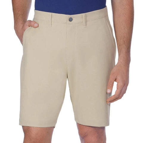 Beige shorts worn by a person on a white background