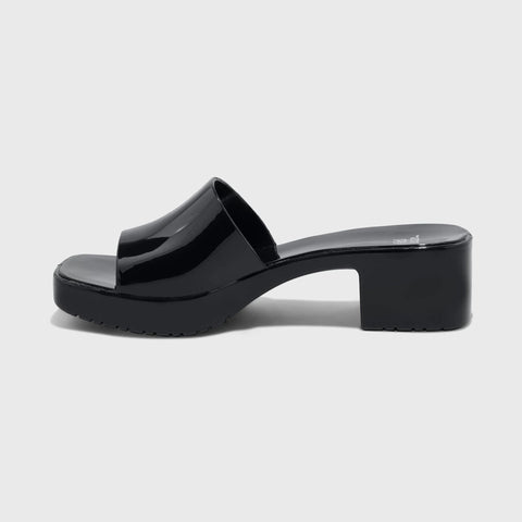 Black platform sandal on a light gray background