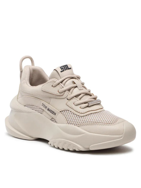 Beige sneaker with 'Steve Madden' branding on a white background