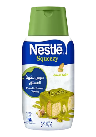 Nestle Squeezzy Pistachio Flavored Topping container on a white background