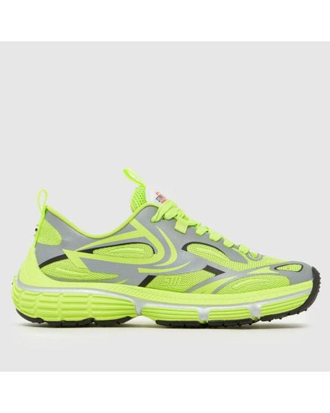 Neon green and gray running shoe on a light gray background