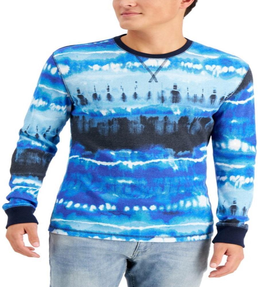 Person wearing a blue tie-dye long-sleeve shirt with a white background