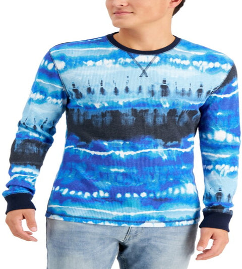 Person wearing a blue tie-dye long-sleeve shirt with a white background