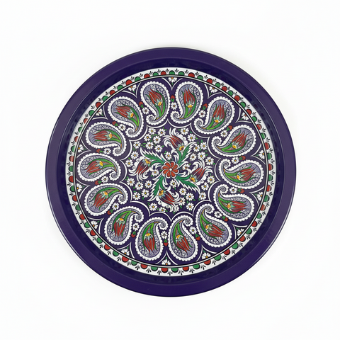 Decorative round tray with paisley pattern on a white background