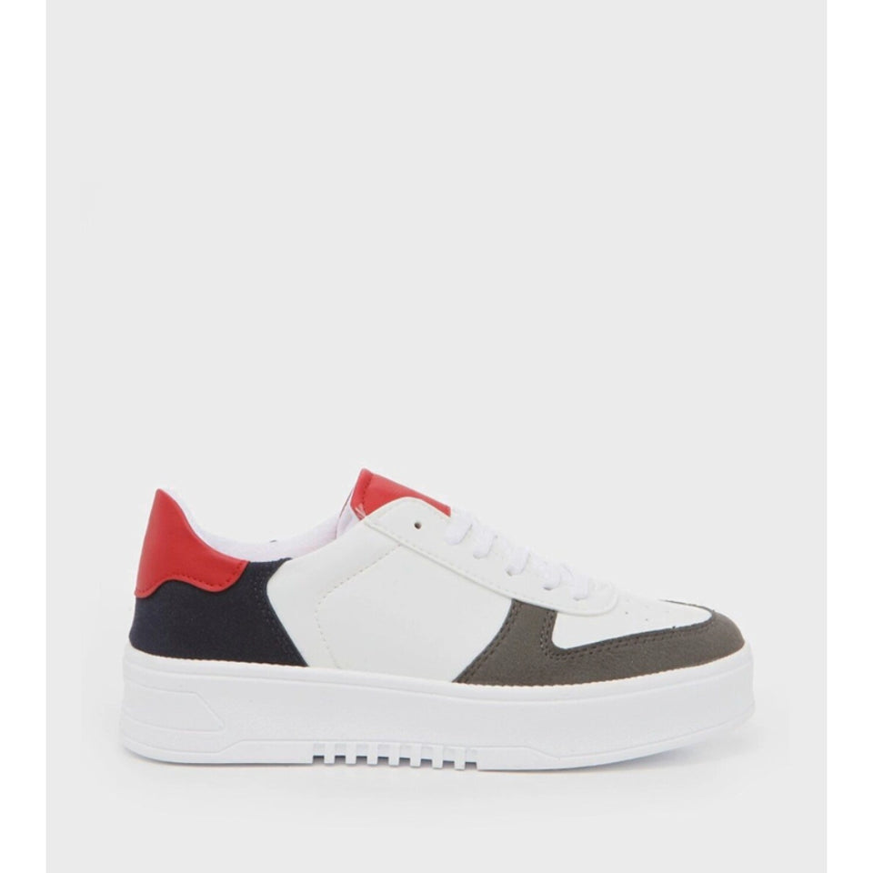 A low-top platform sneaker in white, red, navy, and dark gray, shown from a side profile view against a light gray background.