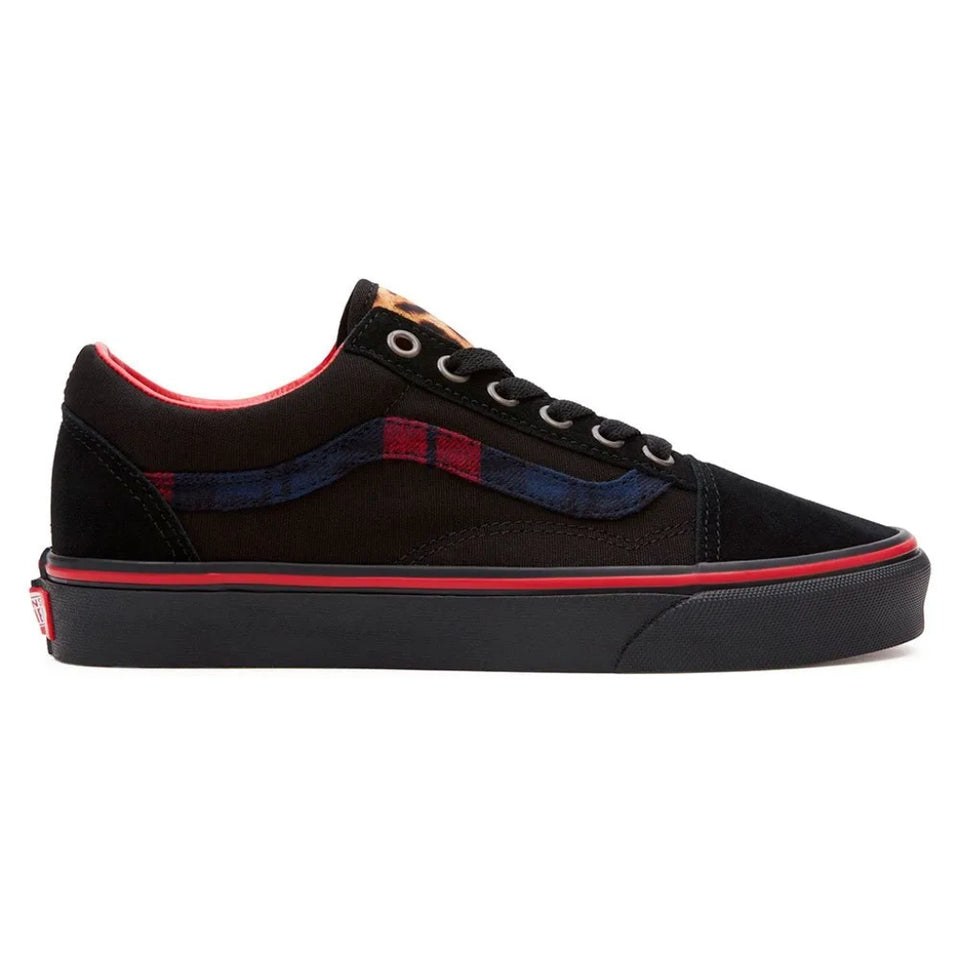A black Vans Old Skool sneaker with a red and blue plaid side stripe, black laces, and a red stripe along the midsole, shown against a plain white background.