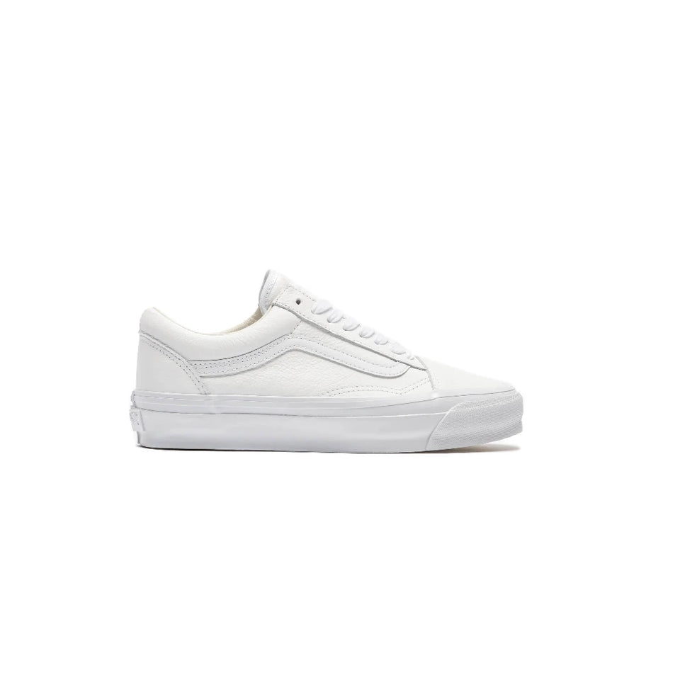 A classic low-top sneaker in all-white, featuring white leather panels, white laces, and a white rubber sole, shown from a side profile view against a plain white background.