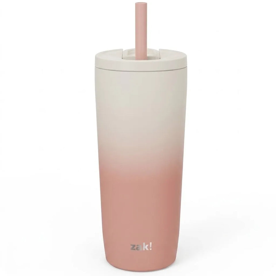 A tall insulated tumbler with a lid and straw, featuring a vertical ombré color transition from off-white at the top to dusty pink at the bottom. The brand name 'zak!' is printed near the base.