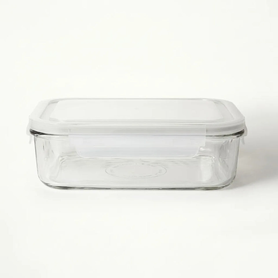 A rectangular clear glass storage container with a matching clear plastic lid, shown on a plain white background.