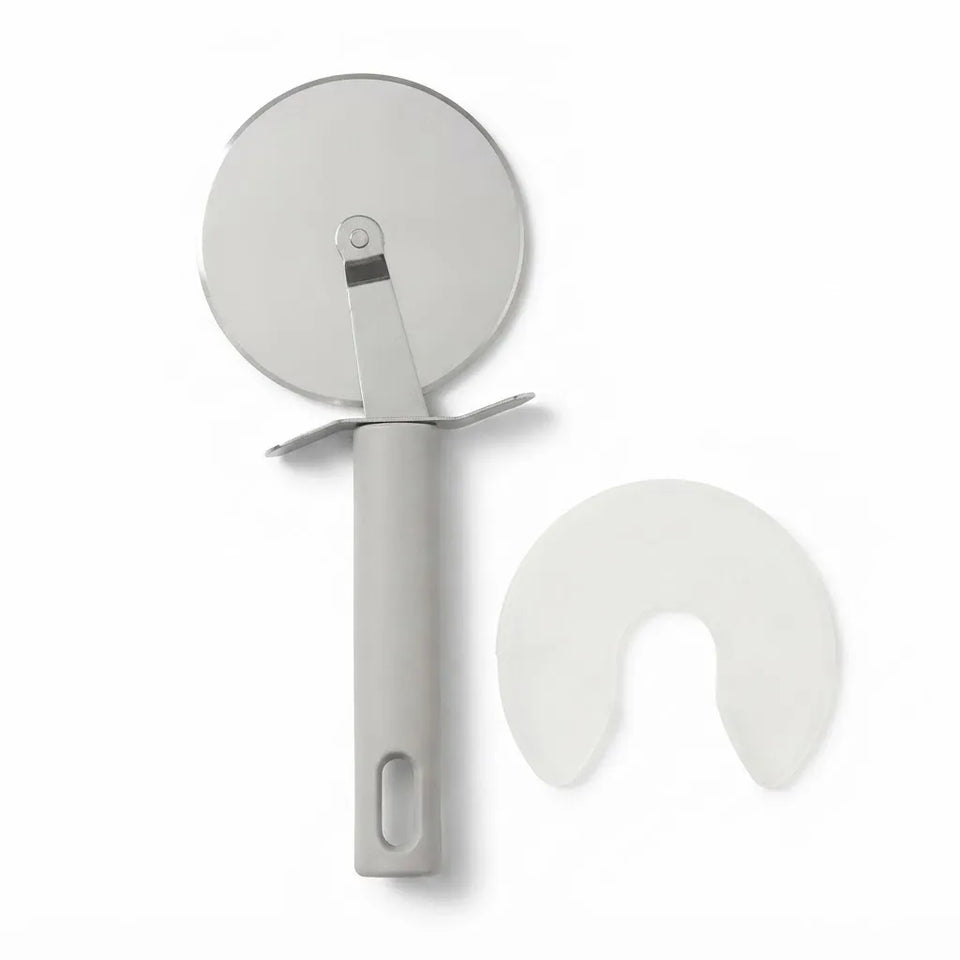 A pizza cutter with a light gray handle and a circular silver metal wheel, shown alongside a clear curved protective cover on a plain white background.